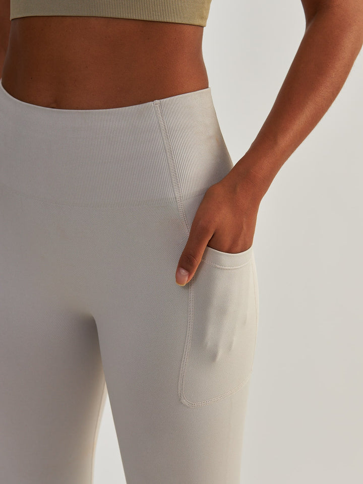 Kompresyjne Jasnoszare Legginsy z Kieszeniami - Lift Me Up